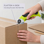 Cutting down the seam of a cardboard box with the cordless rotary scissors