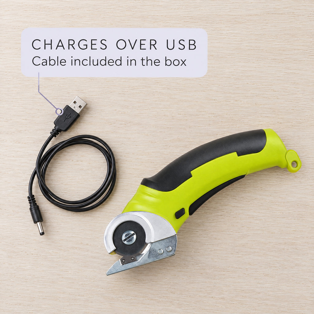 Cordless rotary scissors with the USB charging cable included in the box